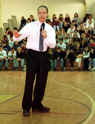 Patrick Reynolds speaks to a group of high school students.