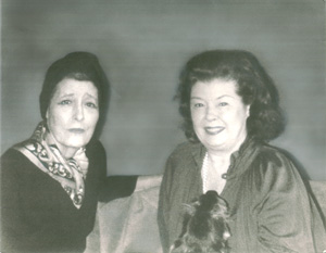 Muriel (wife 3) and Marianne are pictured seated together on a couch.